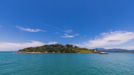 Fototapeta premium Island under blue sky in blue sea