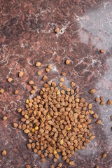 Bunch of fresh unpeeled chickpeas on tile