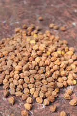 Bunch of unpeeled chickpeas on a tile