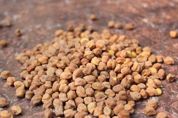 Bunch of unpeeled chickpeas on a tile