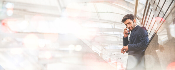 Double exposure of Caucasian businessman using smartphone and watch the clock with blur abstract city, panorama image use for cover design.