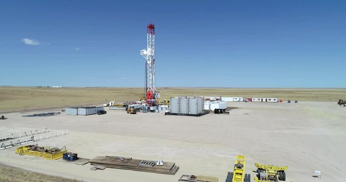 Big rig oil drilling fracking pad tower approach. Drone 4k 60fps.