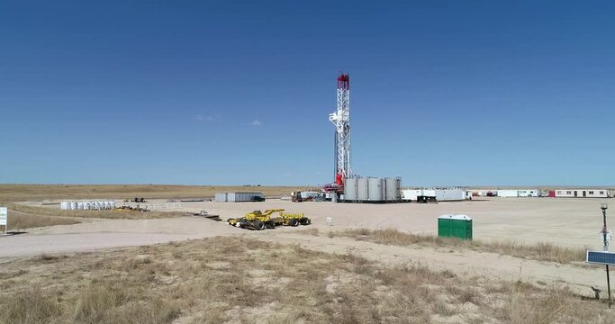 Drone rig approach low altitude over pad equipment. drone 4K 60fps