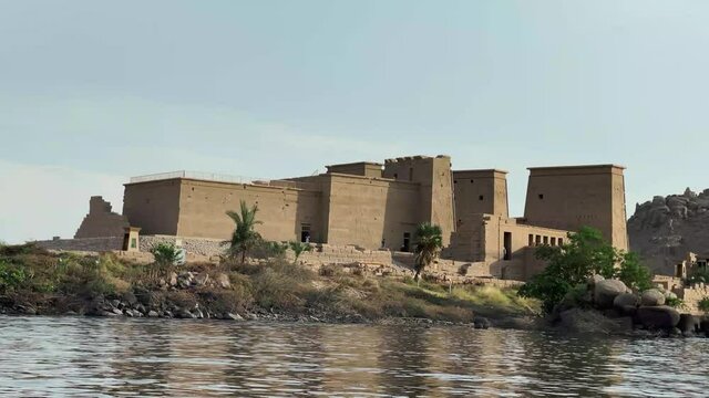 Beautiful Philae temple at sunset light the beautiful temple of Philae, and the Greco-Roman buildings are seen from the Nile river a temple dedicated to Isis, goddess of love. Aswan. Egypt