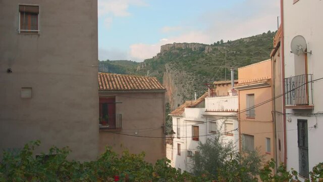 View from left to right of houses on both side of the road in Jerica old town in Valencian community, Castellon province, Spain. 4K video.