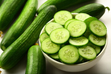 Healthy vegan diet appetizer foods- bowl of delicious fresg green cucumber salad with herbs.