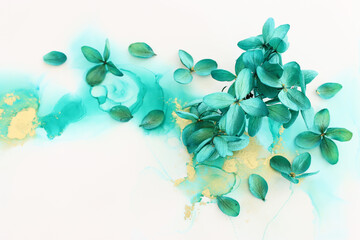 Creative image of emerald and green Hydrangea flowers on artistic ink background. Top view with...