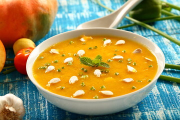 Homemade delicious organic pumpkin cream soup .