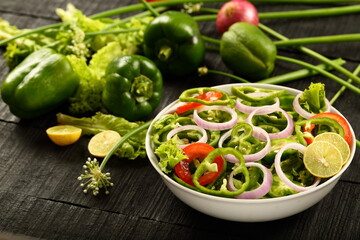 Healthy vegetarian diet meal- fresh green capsicum , paprika salad.