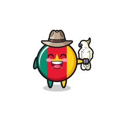 Obraz premium cameroon flag zookeeper mascot with a parrot
