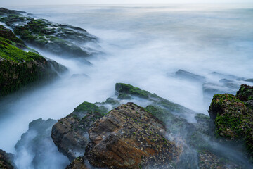 waves and rocks in long exposure