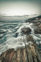 waves and rocks in long exposure