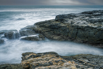 waves and rocks in long exposure