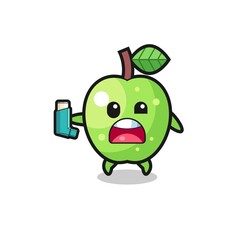 green apple mascot having asthma while holding the inhaler