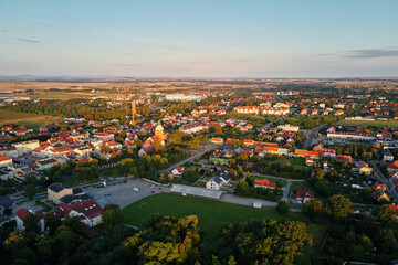 Aerial view of small european town with sradium and sport field