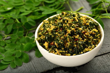 Muringayila thoran- homemade delicious Moringa oleifera leaves stir fry with coconut and herbs.