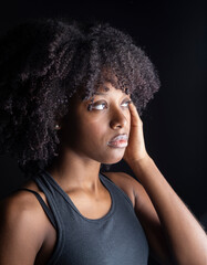 Fototapeta premium pretty afro american woman in studio dark background pretty model, makeup, seriousness
