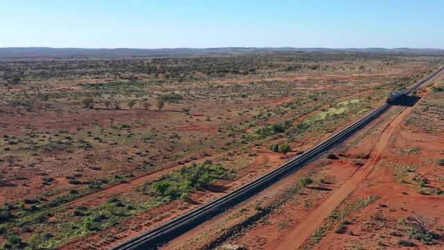 Intercity train on railway road of Broken Hill in Australian outback desert &ndash; 4k.
