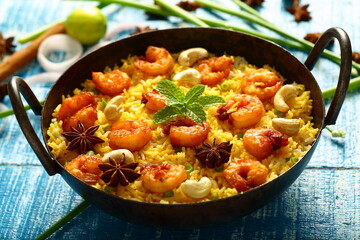 Homemade delicious seafood biriyani, biryani cooked in iron skillet. 