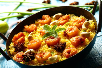 Traditional Seafood biryani cooked in iron skillet, 