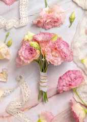 Pink flowers bouquet on marble table