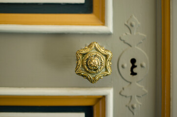 Brass door knob or door handle of a medieval castle in the Loire Valley, France