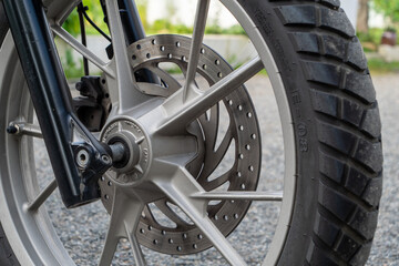 Close-up of motorcycle brakes and front wheel