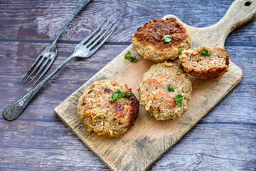 Home made  fried meatballs   on wooden rustic background.Cutlets from beef and pork meat.