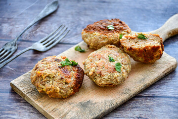 Home made  fried meatballs   on wooden rustic background.Cutlets from beef and pork meat.
