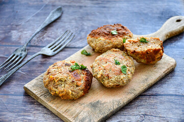 Home made  fried meatballs   on wooden rustic background.Cutlets from beef and pork meat.