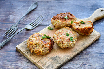 Home made  fried meatballs   on wooden rustic background.Cutlets from beef and pork meat.