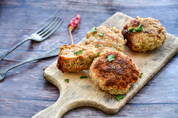 Home made  fried meatballs   on wooden rustic background.Cutlets from beef and pork meat.