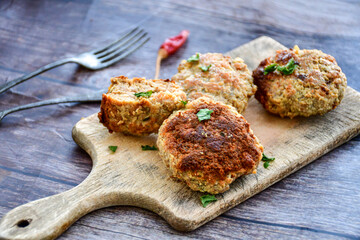 Home made  fried meatballs   on wooden rustic background.Cutlets from beef and pork meat.