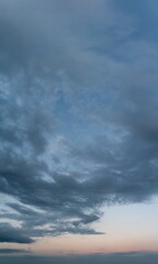 Fantastic clouds at sunrise, vertical panorama