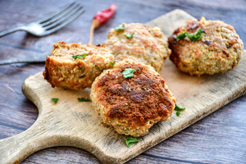 Home made  fried meatballs   on wooden rustic background.Cutlets from beef and pork meat.