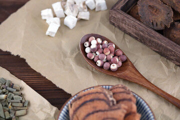 Chinese medicine Gorgon rice in a wooden spoon