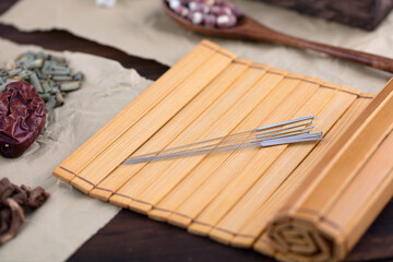 Acupuncture silver needles on bamboo slips