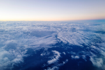 Naklejka na ściany i meble Aerial View on clouds at sunrise