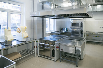 Commercial kitchen work surface and kitchen equipment in professional kitchen.