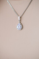 Trending silver jewelry set on a beautiful young girl with long dark hair. Beauty and fashion 
