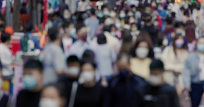 Blur view of Hong Kong people cross the street