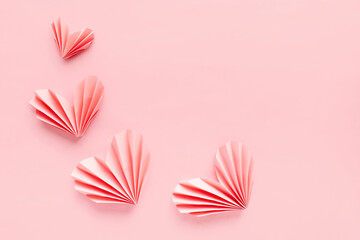 Paper hearts on pink background. Symbol of love for valentines day, happy birthday, greetings, Mothers day, Women's day. Origami. - obrazy, fototapety, plakaty