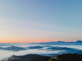aerial view of sunrise above mountain range