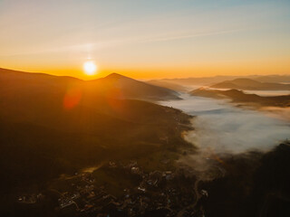 aerial view of sunrise above mountain range