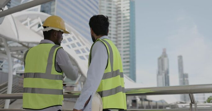 Group of businessmen and architects meeting to work on an analysis of urban building structures to be modern and environmentally friendly. Presentation of teamwork information. construction business