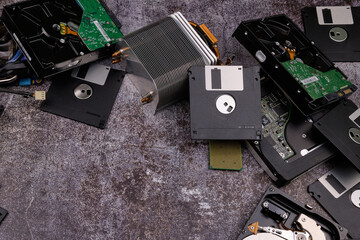 Group of old and used computer components on dark cement-like background. recycling and e-waste...