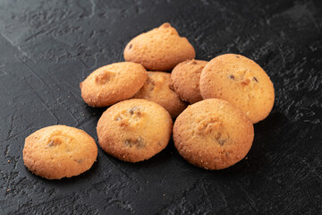 Healthy food concept. Homemade organic energy cookies on black slate stone background with copy space