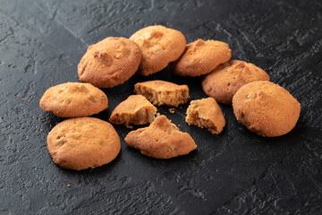 Healthy food concept. Homemade organic energy cookies on black slate stone background with copy space