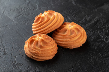 Healthy food concept. Homemade organic energy cookies on black slate stone background with copy space