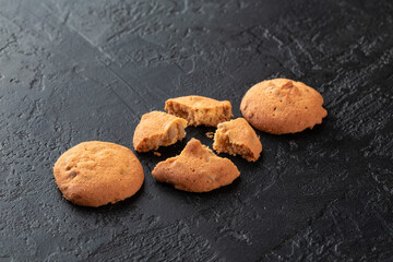 Healthy food concept. Homemade organic energy cookies on black slate stone background with copy space
